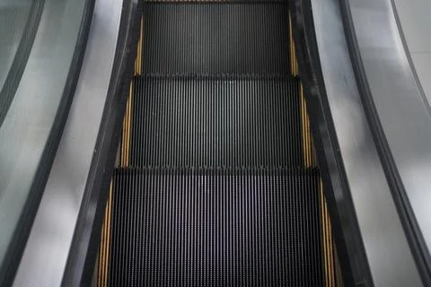 Modern escalator electronic system moving Stock Photos