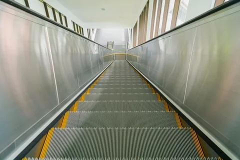 Modern escalator electronic system moving. escalator in a shopping center. .. Stock Photos