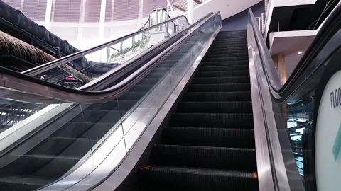 Modern escalator in the mall moves up Stock Footage 132294297
