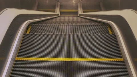 Modern escalator stairs moving down from city to subway,slow motion shot. 動画素材 232233509