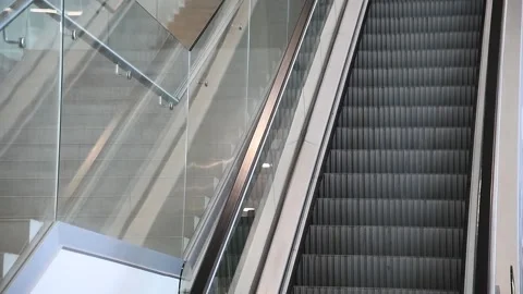 Modern escalator stairs, which moves indoor Stockbeeldmateriaal 161420487