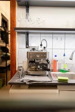 Modern espresso machine sits on kitchen counter Stock Photos