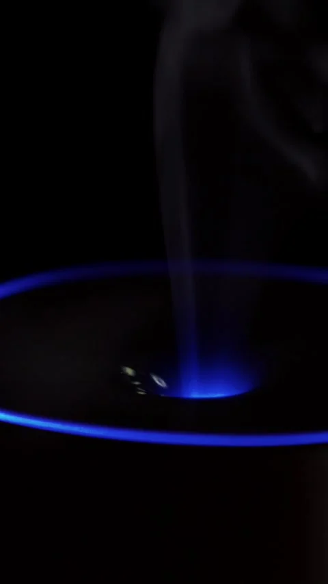 Modern essential oil diffuser dispensing smooth cool mist vapor with ambient Stock Footage 348026529