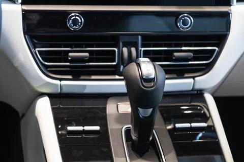 Modern expensive car interior and gearbox shift handle Photos