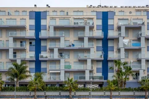 Modern facade of a building with windows Stock Photos