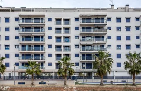 Modern facade of a building with windows Stock Photos