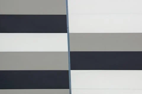 Modern facade of composite panels, view from outside. Abstract architecture Stock Photos