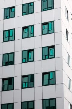 Modern facade of office building with reflections in windows Fotos de archivo