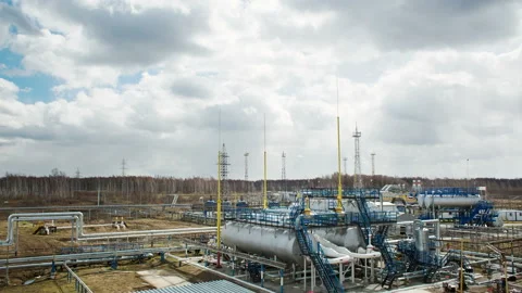 Modern facility with pipes or powerful process area at the oil depot or tank far Stock Footage 199487808