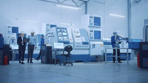 Modern Factory with Professional Workers, Engineers, Managers Working on Product Stock Footage 124059229