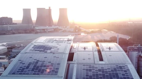 Modern factory solar panel rooftop and fossil fuel power station at Stock Footage 171272173