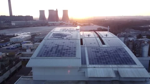 Modern factory solar panel rooftop and fossil fuel power station at Stock Footage 171272341
