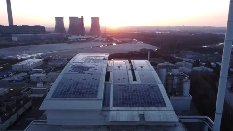 Modern factory solar panel rooftop and fossil fuel power station at Stock Footage 171272350