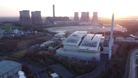 Modern factory solar panel rooftop and fossil fuel power station at Stock Footage 171272382