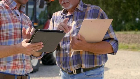 Modern farmers using technology on the farm Stock Footage 94861356
