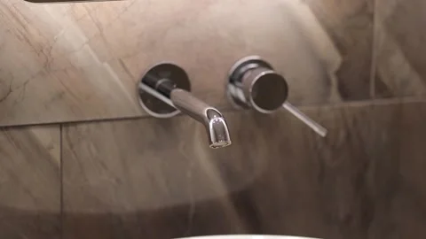 Modern faucet close-up. Frames for advertising services of plumbing systems. Stock Footage 247728392