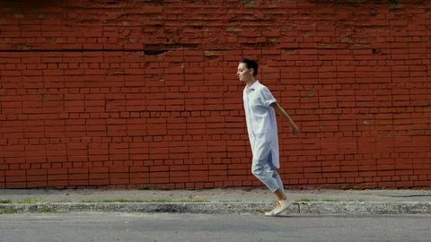 The modern female ballet dancer dancing in the street. Slow motion. HD Stock Footage 81115579