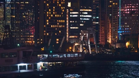 Modern ferry zips by Star Ferry in Victoria bay, Hong Kong Stock Footage 124996564
