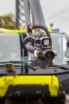 Modern firefighting system mounted on a hydraulic arm of a fire truck - high  Stock Photos