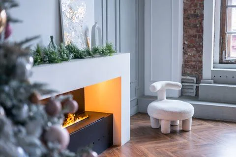 Modern fireplace sitting area with two leather chairs. Interior design. Stock Photos