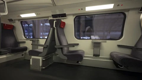 Modern first-class cabin of a Swiss double-decker train offers spacious, clean Stock Footage 316633441