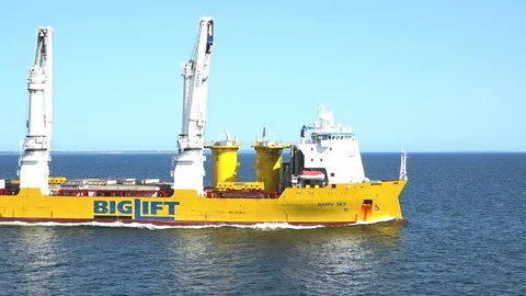 Modern floating crane ship sails leaving foaming waves Stock Footage 113459035