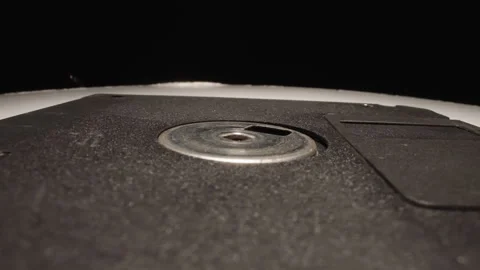 Modern floppy disk for watching eclipses on black background Vídeo Stock 244342875