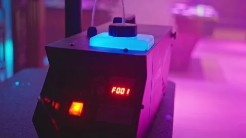 A modern fog machine creates a stunning atmosphere in a vibrant, energetic club Stock Footage 310334944