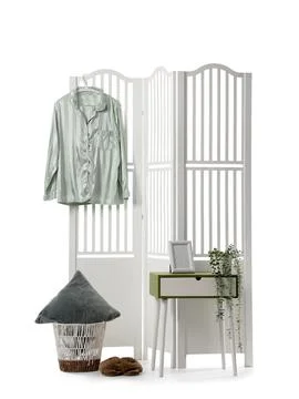 Modern folding screen with bedside table and pajamas isolated on white backgr Stock Photos