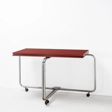 Modern folding table convertible into a console, with chromed tubular steel.. 写真素材
