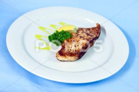 Modern Food On A White Plate And Blue Background - Grilled Salmon With Lemon