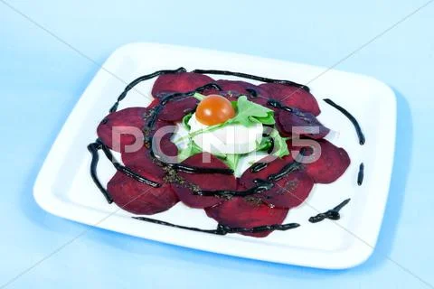 Modern Food On A White Plate And Blue Background