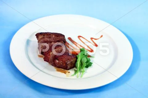 Modern Food On A White Plate And Blue Background