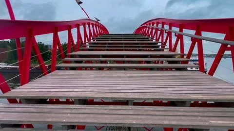 Modern footbridge Python Bridge at Eastern Docklands neighborhood of Amsterdam 스톡 사진