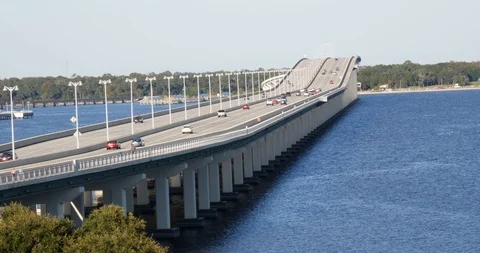 Modern freeway crossing a stretch of water Stock Footage 88643389