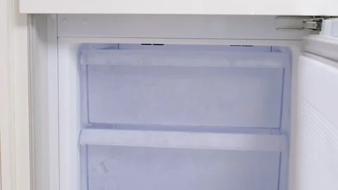 Modern freezer with empty drawers front view close-up. Stock Footage 311086180