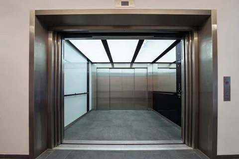 Modern freight elevator with open doors Stock Photos