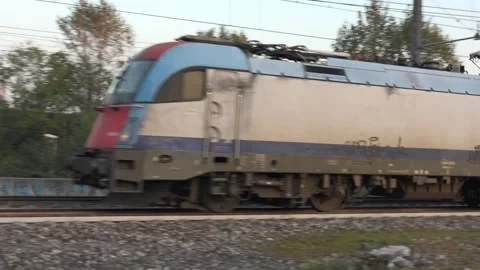 Modern freight train running on a scenic route, hauled by a Siemens E190 loc Stock Footage 292638396