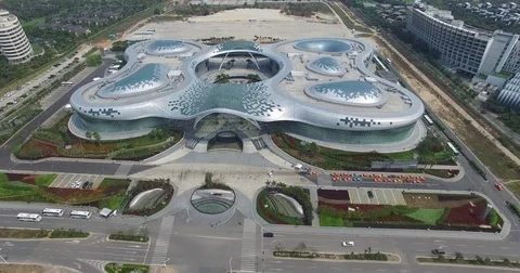 Modern futuristic buildings of a shopping mall in Sanya in China, 4K Stock Footage 70304553