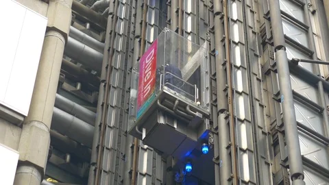 MODERN FUTURISTIC OUTDOOR ELEVATORS GOING UP AND DOWN Stock Footage 82582644