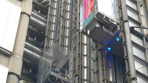 MODERN FUTURISTIC OUTDOOR ELEVATORS MOVING ON SKYSCRAPER Stock Footage 82582779