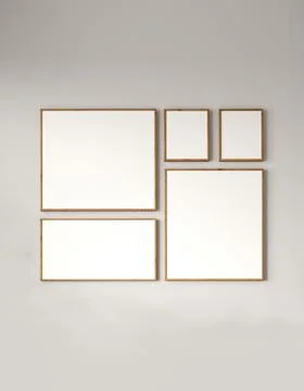 Modern gallery wall with a collection of empty picture frames on a muted Illustrazione stock