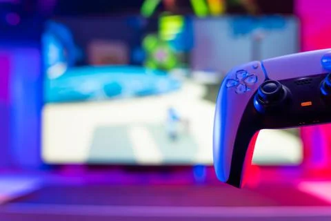 Modern gamepad on a technological background. Close-up. Video games, mobile g Stock Photos