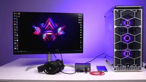 Modern Gaming Desktop Setup with RGB PC, Monitor, Headphones and Docking Station Stock Footage 333708724