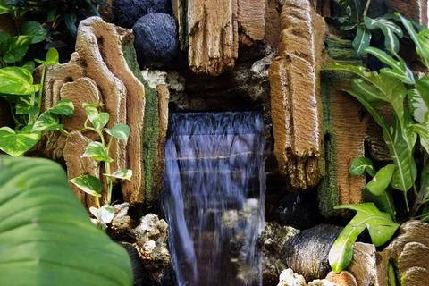Modern garden composition with waterfall Stock Photos