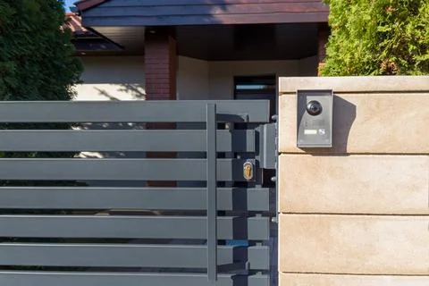 Modern gate with security intercom system Stock Photos