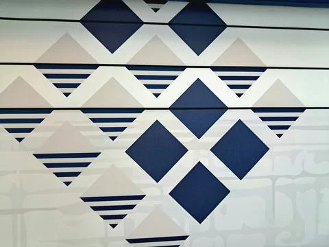 Modern geometric pattern background with blue navy and cream diamond shapes. Stock Photos