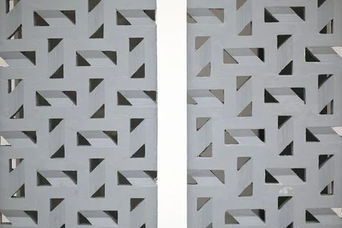 Modern geometric patterned wall with triangular cutouts Fotos de archivo