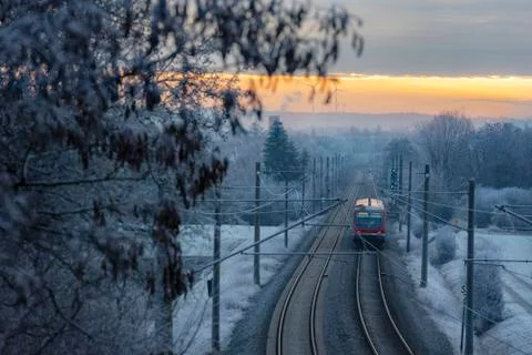 Modern German train  through snowy nature Stock Photos