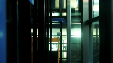 Modern glass elevator descending to the ground floor. Elevator going down. Stock Footage 142495012